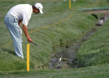 What happens when a golf ball falls in the water?