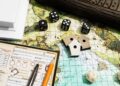Board Games Print Their Rules, Video Games Hide Them